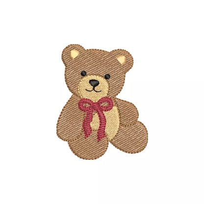 Motif de broderie machine ourson assis avec boucle rouge sous le menton.